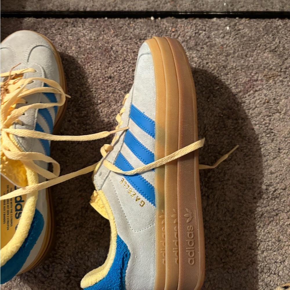 Blue and yellow Simba's half a size too big never worn perfect condition